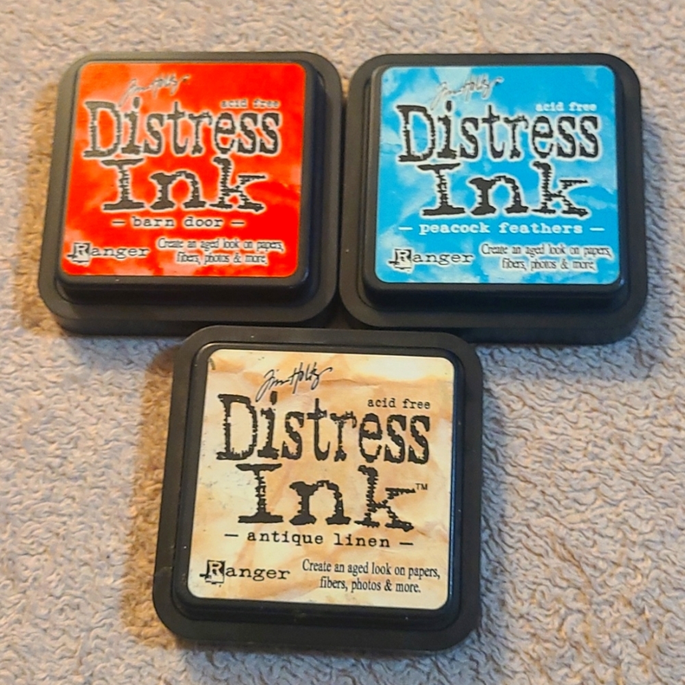 Distress Ink stamp pads by Jim Holtz 3 colors included.
